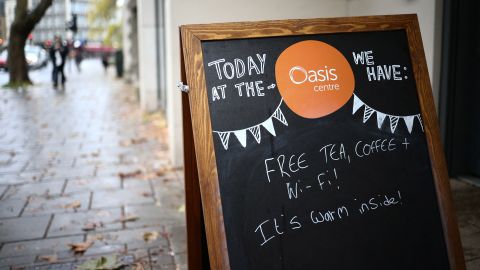 A welcoming sign outside the Oasis Centre, an open to all communal area which acts as a 'warm bank', in London, on December 12.