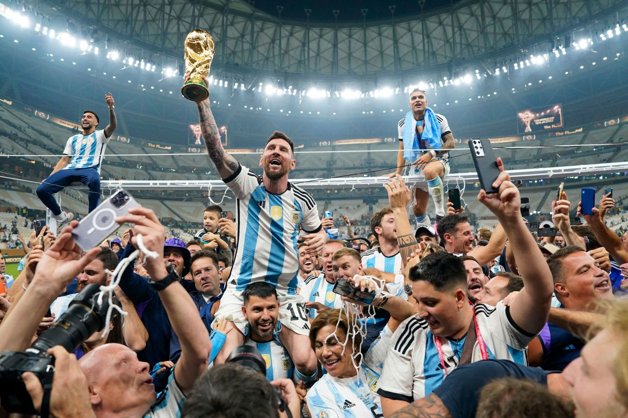 <a href="https://www.cnn.com/2022/12/15/football/gallery/lionel-messi/" target="_blank">Lionel Messi</a> lifts the World Cup trophy as he and the Argentina men's football team celebrate their World Cup victory over France in Lusail, Qatar, on Sunday, December 18. <a href="https://www.cnn.com/2022/11/20/football/gallery/world-cup-2022/" target="_blank">See the 2022 World Cup's best images.</a>