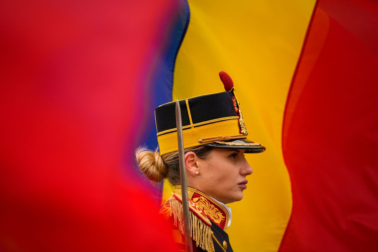 An honor guard soldier stands at attention on Wednesday, December 21, during a memorial service for those killed in the 1989 anti-communist uprising at University Square in Bucharest, Romania.