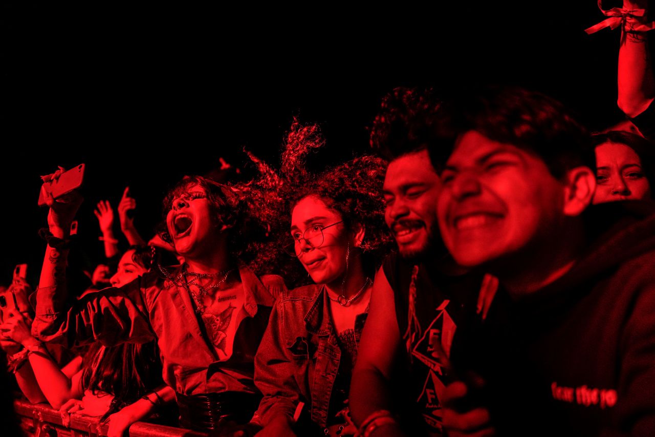 People enjoy a front-row spot at the Cusica Fest music festival in Caracas, Venezuela, on Sunday, December 18.