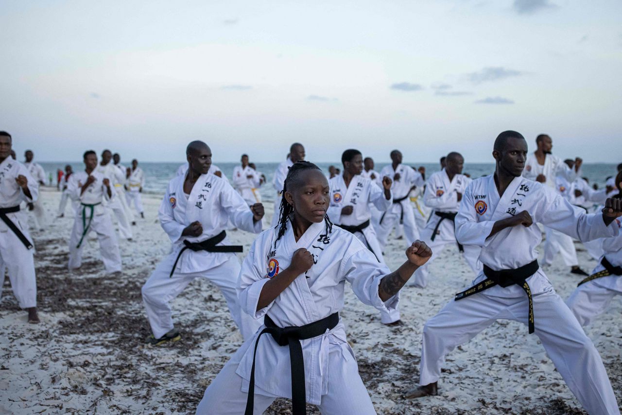 Athletes perform on a beach in Mombasa, Kenya, ahead of the Mombasa Open Tong-IL Moo-Doo International Martial Arts Championship on Thursday, December 15.