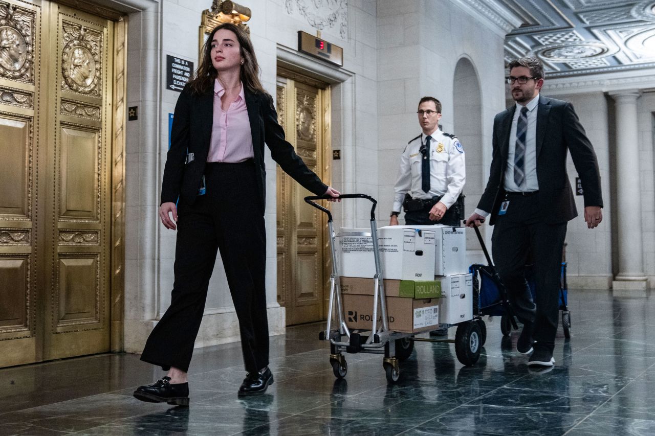 Congressional staff wheel in former President Donald Trump's tax returns on Capitol Hill in Washington on Tuesday, December 20. The Democratic-led House Ways and Means Committee said Tuesday it would <a href="https://www.cnn.com/2022/12/20/politics/house-trump-tax-returns/index.html" target="_blank">release the former president's tax returns</a> within days. The committee also <a href="https://www.cnn.com/2022/12/21/investing/trump-taxes/index.html" target="_blank">released a report</a> Tuesday that detailed six years' worth of the former president's tax returns, including his claims of massive annual losses that significantly reduced his tax burden.