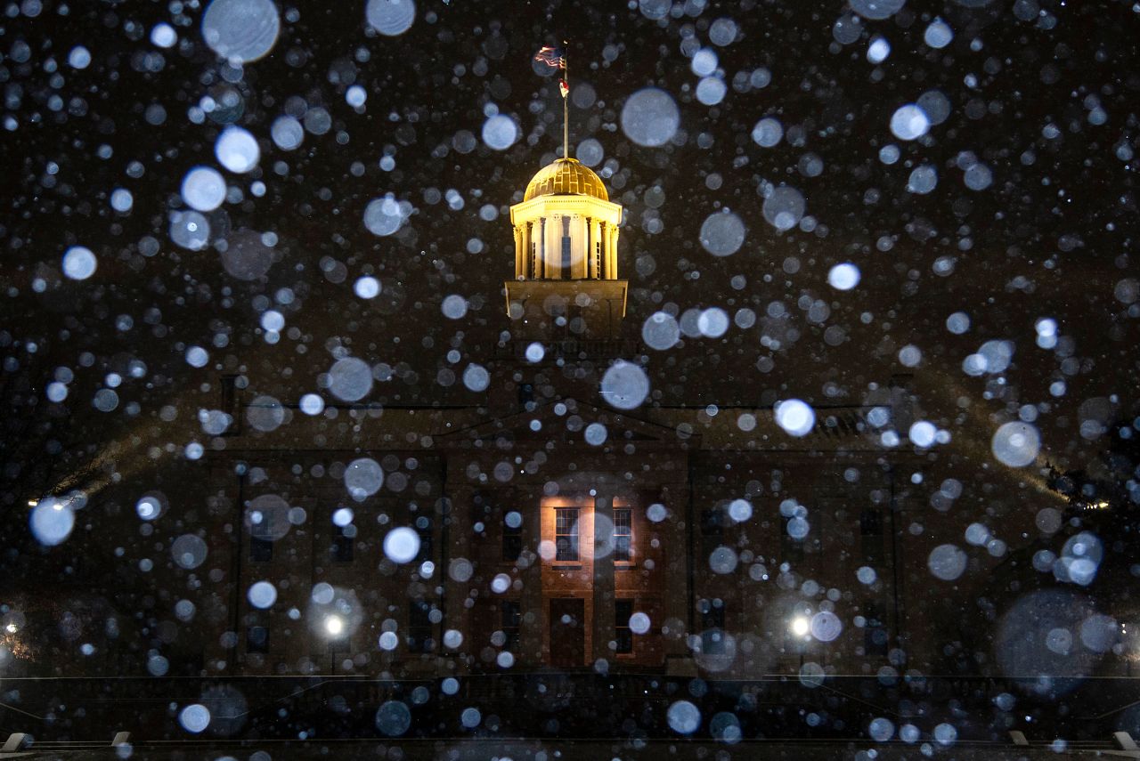 Snow falls at the Old Capitol Building in Iowa City, Iowa, on Wednesday, December 21.