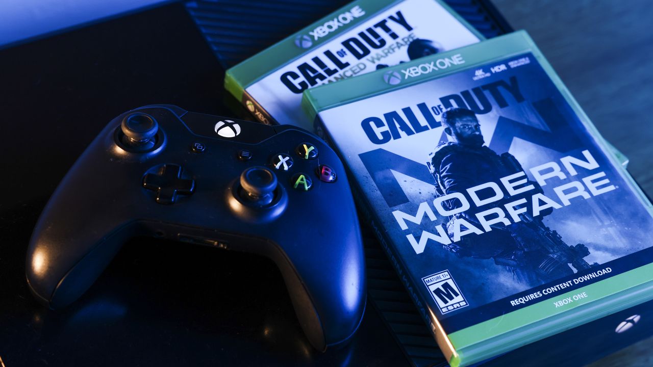 Activision Blizzard's Call of Duty: Modern Warfare video game and Microsoft's Xbox One video game controller arranged in Denver, Colorado, U.S., on Wednesday, Jan. 19, 2022.