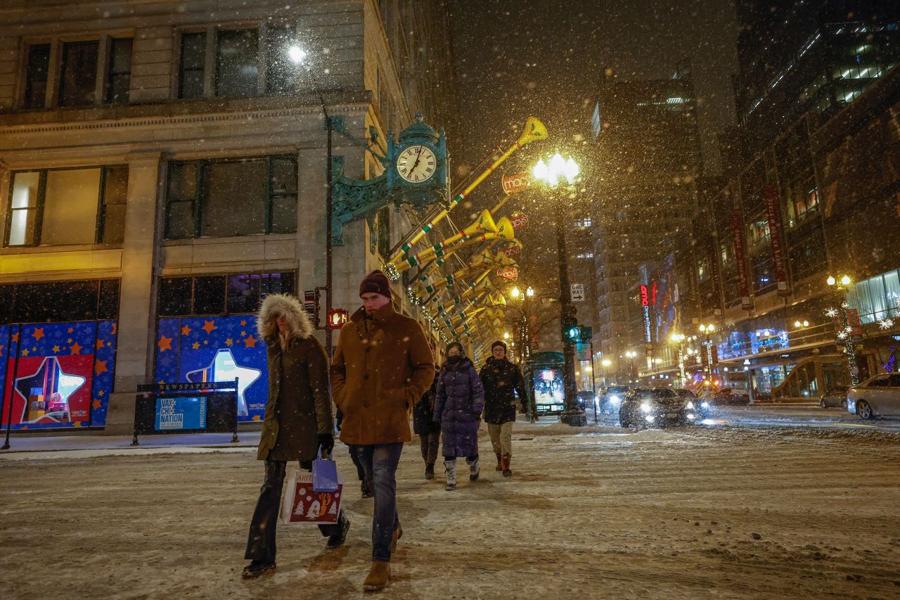 Pedestrians cross the street in Chicago on December 22. 