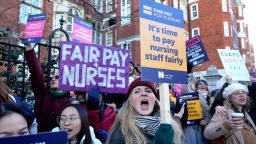 Nurses demonstrate towards passing traffic as they stand at a picket line outside the Royal Marsden Hospital in London, Thursday, Dec. 15, 2022, during what is expected to be a month of strikes by public service workers. 