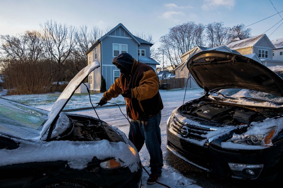 Antonio Smothers jump-starts his vehicle in Nashville on December 23.