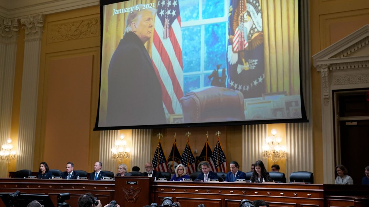 A video of former President Donald Trump is shown on a screen on Capitol Hill on December 19, 2022. 