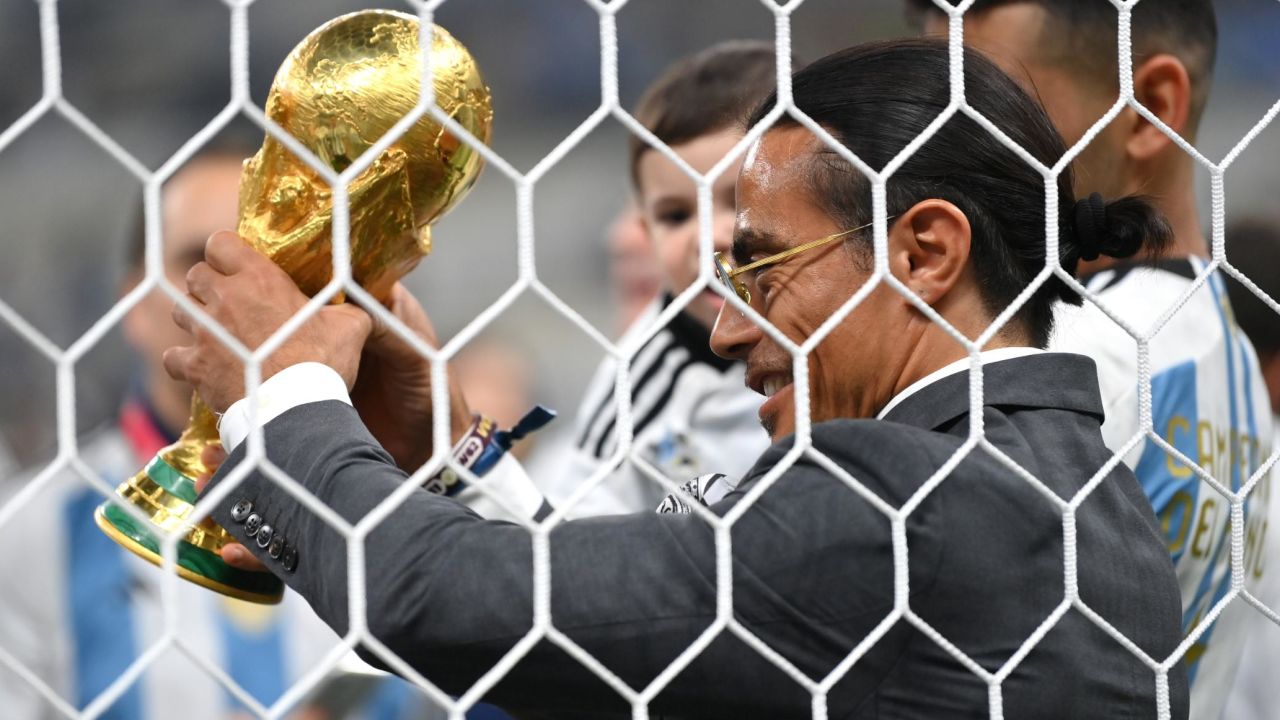 Nusret Goekce, nicknamed Salt Bae, holds World Cup trophy after the final.