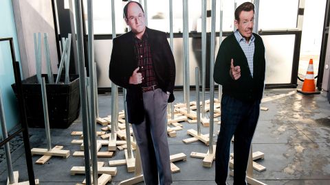 Cutouts of actor Jason Alexander (left) and the late Jerry Stiller are shown with festivus poles being handed out to fans at Hulu's pop-up installation called Seinfeld: The Apartment in West Hollywood, California. increase.  December 20, 2015. 