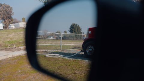 A tanker truck makes a water delivery in Tooleville.