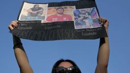 A woman holds a sign against the execution of Iranian footballer Amir Nasr-Azadani -sentenced to death in connection with protests following the death of Mahsa Amini, during a protest in front of the Iranian embassy in Mexico City, on December 19, 2022. - Amir Nasr-Azadani was arrested in the city of Isfahan two days after allegedly taking part in an "armed riot" in which three security agents were killed, (Photo by Pedro PARDO / AFP) (Photo by PEDRO PARDO/AFP via Getty Images)