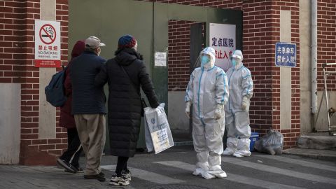 Medical staff wait to help a patient at a fever clinic treating patients with Covid-19 in Beijing on December 21, 2022.