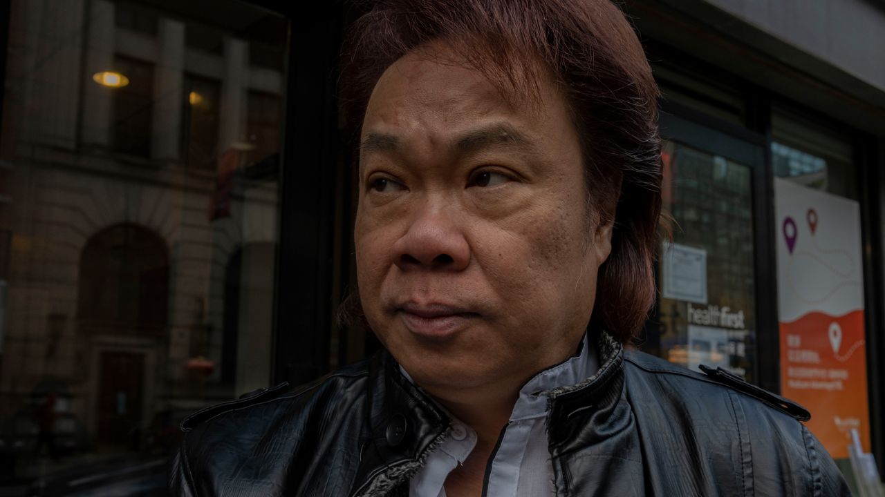 Jimmy "Bighead" Tsui smokes a cigarette in Manhattan's Chinatown, New York City, on December 17. 