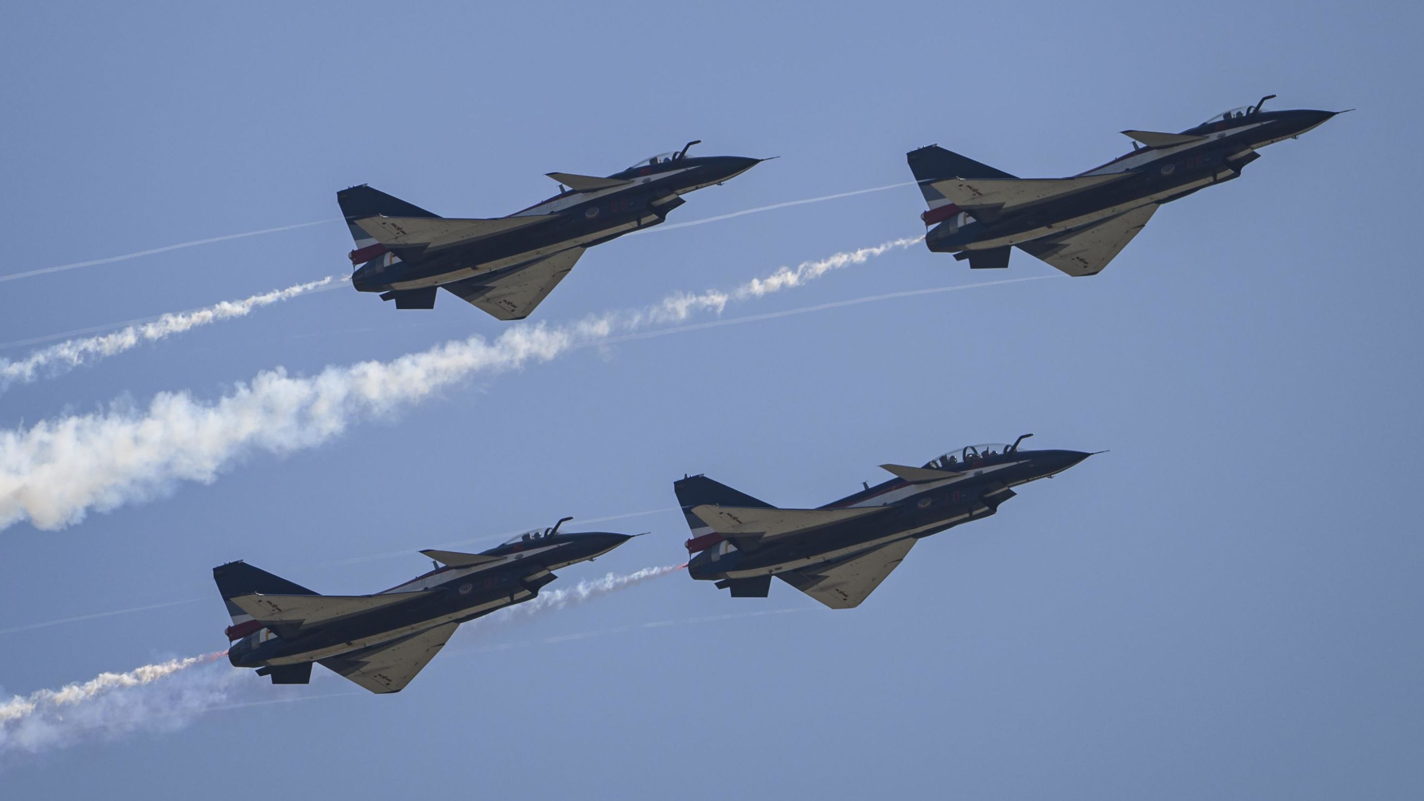Chinese J-10 fighter jets shown in formation during a 2022 Airshow in Zhuhai, China. 