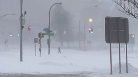 High winds and snow cover streets and vehicles in Buffalo on Sunday, December 25, 2022. 