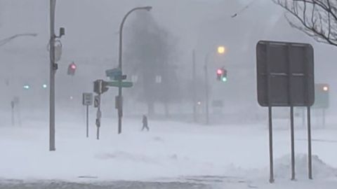 High winds and snow blanket the streets and vehicles of Buffalo, Sunday, Dec. 25, 2022. 