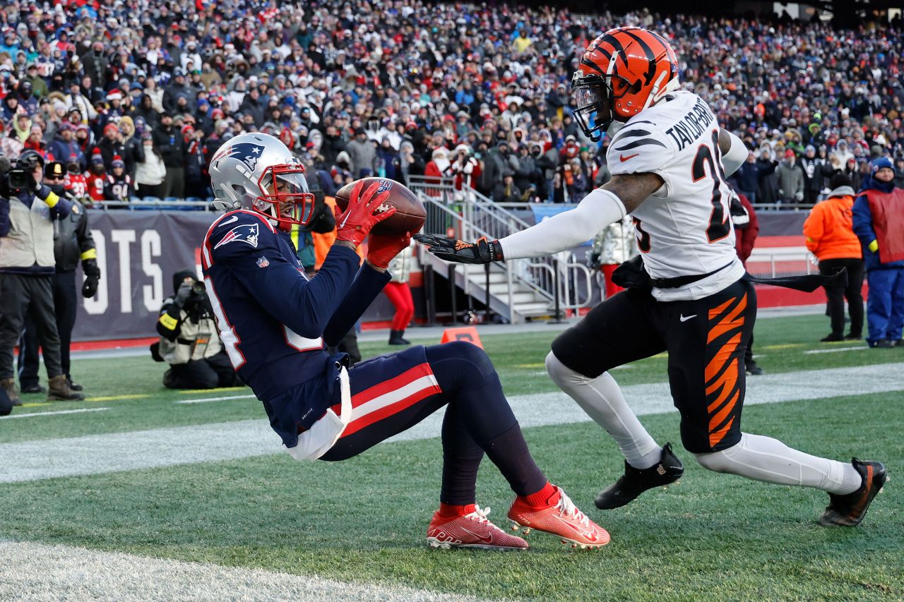 Kendrick Bourne of the New England Patriots catches a touchdown over Cam Taylor-Britt of the Cincinnati Bengals during the fourth quarter at Gillette Stadium on December 24. The Bengals won 22-18.
