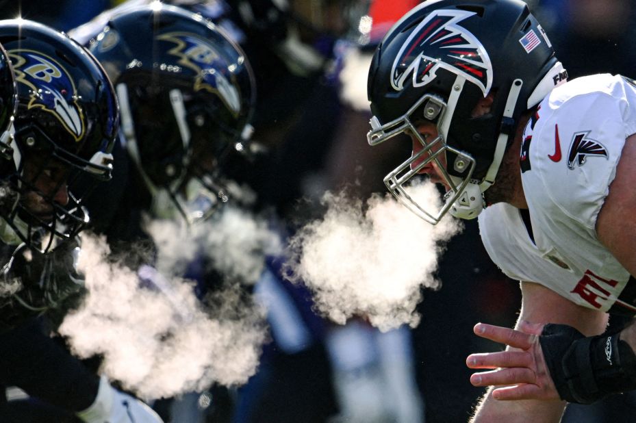 Atlanta Falcons center Drew Dalman prepares to snap the ball during the first half against the Baltimore Ravens at the M&T Bank Stadium. The Ravens won 17-9.