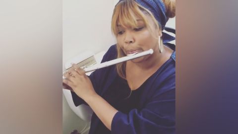 Lizzo playing the flute in a video Instagram post in 2017. 
