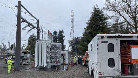 A Tacoma Power crew works at an electrical substation damaged by vandals early on Christmas morning after cutting a padlock to gain entry according to a crew manager, Sunday, Dec. 25, 2022 in Graham, Washington.