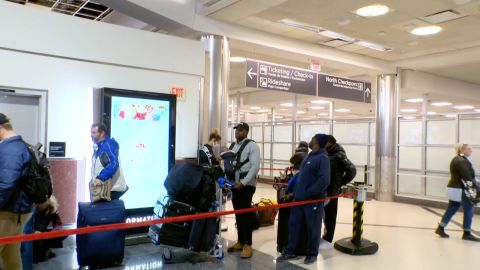 Customers wait to rebook their Southwest Airlines flight at Hartsfield-Jackson Atlanta International Airport on Monday.