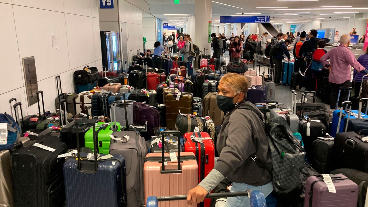 Baggage waits to be claimed after canceled flights at the Southwest Airlines terminal at Los Angeles International Airport on Monday, December 26, 2022, in Los Angeles. 