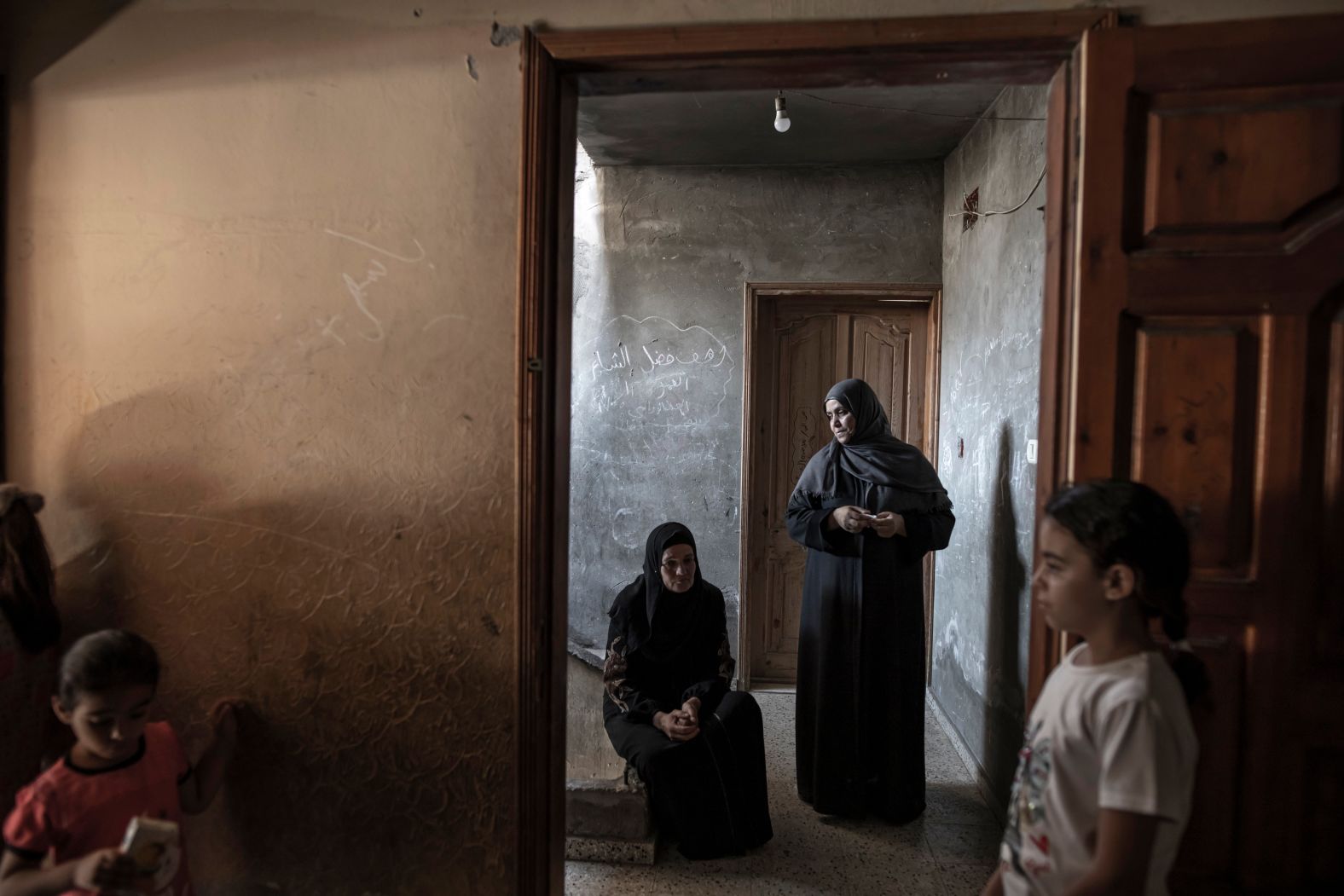 <strong>From </strong><a href="https://fatimashbair.visura.co/" target="_blank" target="_blank"><strong>Fatima Shbair</strong></a><strong>, a photographer based in Gaza City: </strong>"Mourners attend the funeral of 11-year-old Layan al-Shaer in Khan Younis, Gaza. Layan died of her wounds after she was injured in <a href="https://www.cnn.com/2022/08/05/middleeast/israel-gaza-strikes-islamic-jihad-intl/index.html" target="_blank">Israeli airstrikes</a> while she was on a picnic by the sea with her family this past August. The 11-year-old's grandmother and relatives attend her funeral in this photo. Everyone was waiting silently and anxiously for her body to arrive from the hospital to bid her farewell. At that time, I could not separate myself from what was happening around me. I felt it and had to document it. It was heartbreaking. I have photographed so many funerals, but I never forget the funerals of children."