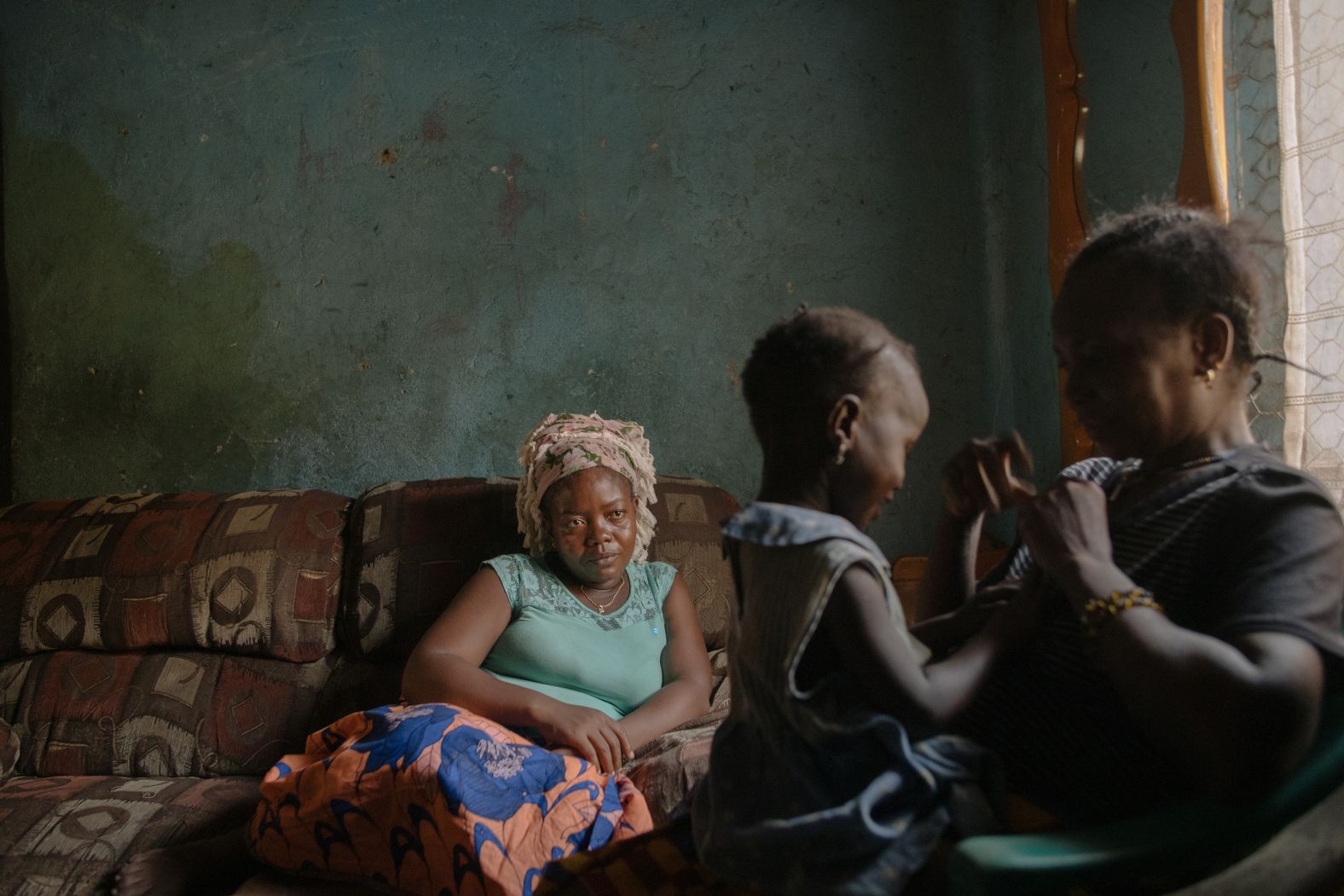 <strong>From </strong><a href="https://www.alinedeschamps.com/" target="_blank" target="_blank"><strong>Aline Deschamps</strong></a><strong>, a photographer based in Beirut, Lebanon: "</strong>Lucy Turay, a former migrant domestic worker and mother of two, pays a visit to her auntie who takes care of her daughter, Ugyatu. Lucy was trafficked to work in Lebanon and enslaved under <a href="https://www.cnn.com/interactive/2020/02/world/lebanon-domestic-workers-cnnphotos/index.html" target="_blank">the kafala system</a> for two years. After being repatriated to her home country, Sierra Leone, her 3-year-old daughter does not recognize her anymore. Ugyatu was too young to remember her mother before her departure to Lebanon. Since then, she has been living with Lucy's auntie, whom she now considers her mother.<br /><br />"Human trafficking and the abuse of migrant domestic workers is one of our biggest contemporary tragedies. Not only in the Middle East, but everywhere. This is one of the many family stories that happen to migrant domestic workers stranded in the Middle East, who sacrifice their lives for their children and let them grow up in their absence. What touches me deeply is that when I asked Lucy how she felt about it, she replied: 'I am so grateful that my auntie takes care of my daughter as her own. And one day, when Ugyatu will be older, I will tell her my story.' "