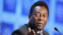 DAVOS, Switzerland:  Former Brazilian soccer star Pele, Director of Empresas Pele (L) talks during the World Economic Forum session "Can a ball change the world: the role of sports in Development" 26 January 2006 in Davos.  AFP PHOTO FABRICE COFFRINI  (Photo credit should read FABRICE COFFRINI/AFP via Getty Images)