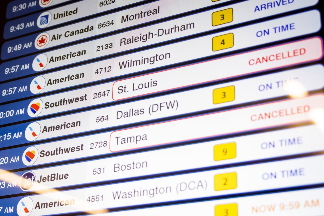 Cancelled Southwest Airlines flights are seen on the flight schedules at LaGuardia Airport, Tuesday, Dec. 27, 2022, in New York. The U.S. Department of Transportation says it will look into flight cancellations by Southwest that have left travelers stranded at airports across the country amid an intense winter storm.   (AP Photo/Yuki Iwamura)