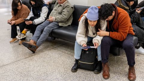 Travelers wait at George Bush Intercontinental Airport on December 27, 2022, in Houston, Texas, after Southwest canceled approximately 5,400 flights in less than 48 hours.