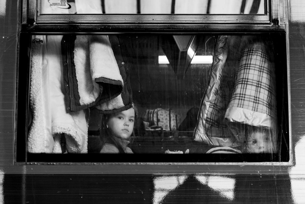 <strong>From </strong><a href="https://www.svetjacqueline.com/" target="_blank" target="_blank"><strong>Svet Jacqueline</strong></a><strong>, a photographer based in Baltimore: "</strong>A young girl and her brother look out the train car window on March 18, 2022, as they head west to Poland. Thousands of Ukrainians, fleeing the war, flooded the Lviv-Holovnyi railway station daily in Lviv, Ukraine.<br /><br />"It is hard to cover the <a href="https://www.cnn.com/interactive/2022/05/world/ukraine-war-photographers-cnnphotos/" target="_blank">war in Ukraine</a> and not feel its impact on a personal level. That being said, I was born into a Russian orphanage as the USSR was collapsing and adopted by American parents when I was a baby. While reporting in Kyiv in April, I was told my great-grandmother was born and raised in Kyiv. The understanding of my personal roots has created a deeper connection to the work I have been doing in Ukraine this past year."