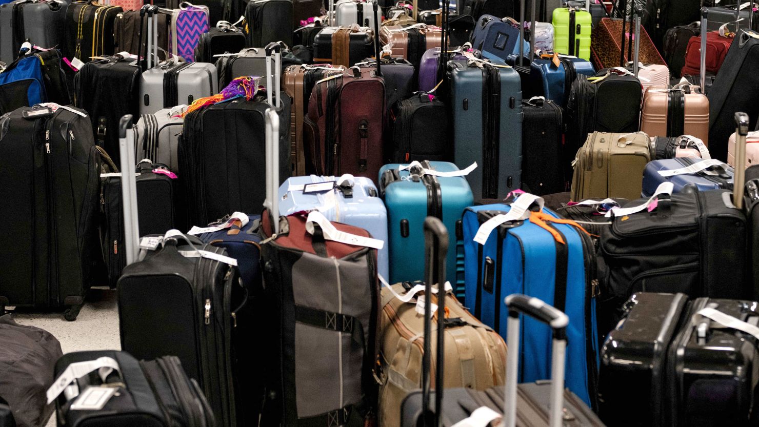 Hundreds of unclaimed suitcases sit near the Southwest Airlines baggage claim area at Nashville International Airport after the airline cancelled thousands of flights in Nashville, Tennessee, on December 27, 2022. - Temperatures were expected to moderate across the eastern and midwest US on December 27, after days of freezing weather from "the blizzard of the century" left at least 49 dead and caused Christmas travel chaos. (Photo by Seth Herald / AFP) (Photo by SETH HERALD/AFP via Getty Images)