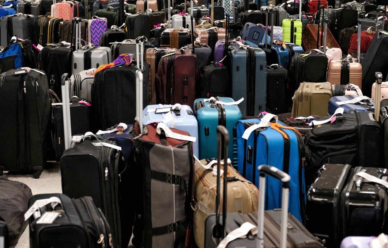 Hundreds of unclaimed suitcases sit near the Southwest Airlines baggage claim area in Tennessee's Nashville International Airport after the airline canceled thousands of flights on December 27.