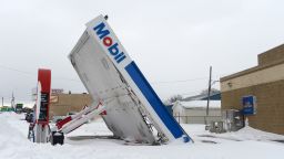 LACKAWANNA, NY - DECEMBER 27:  A gas station canopy lays on its side after high winds and heavy snow along Lake Shore Boulevard on December 27, 2022 in Lackawanna, New York. The historic winter storm Elliott dumped up to four feet of snow on the area leaving thousands without power and at least 28 confirmed dead in the city of Buffalo and the surrounding suburbs. (Photo by John Normile/Getty Images)