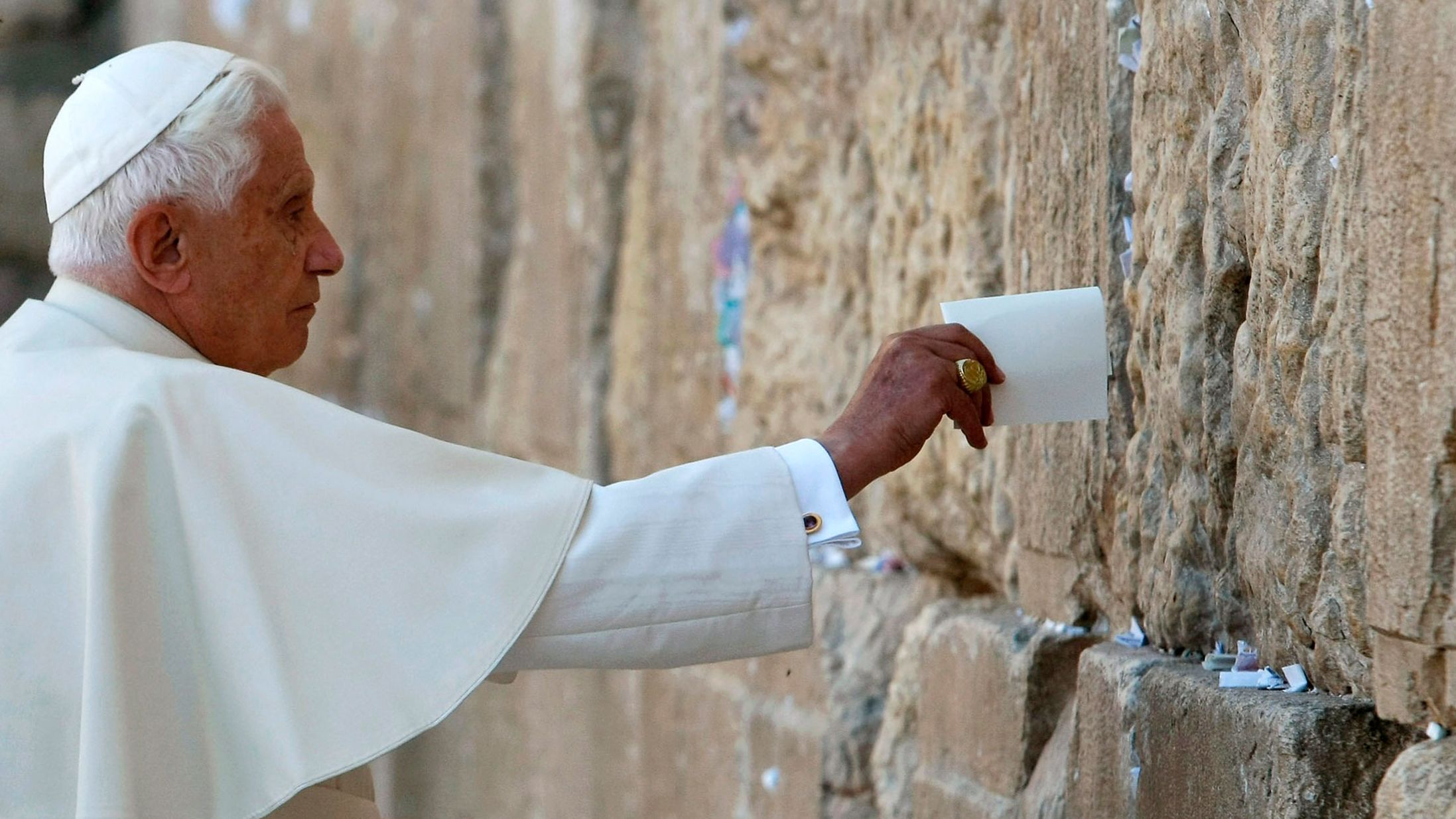 Benedict places a note in the Western Wall while visiting Jerusalem's Old City in May 2009.