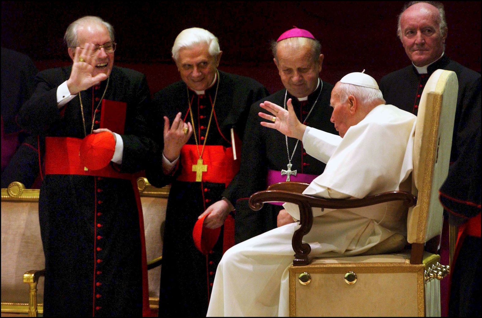 Benedict, second from left, is among several cardinals greeting Pope John Paul II in 2003.