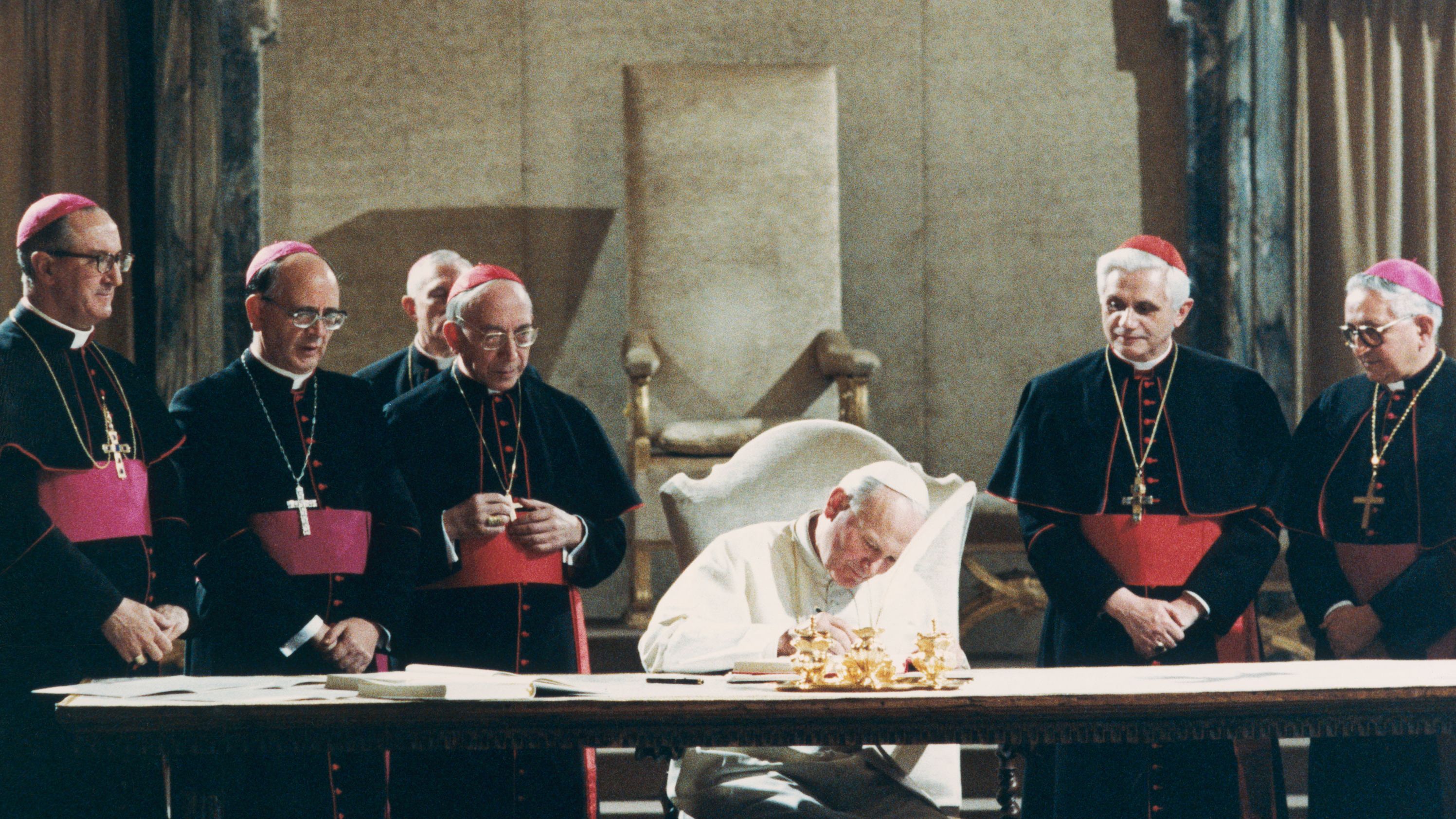 Pope John Paul II signs the new Roman Catholic Code of Canon Law in 1983. Benedict, second from right, served as the Pope's chief theological adviser.