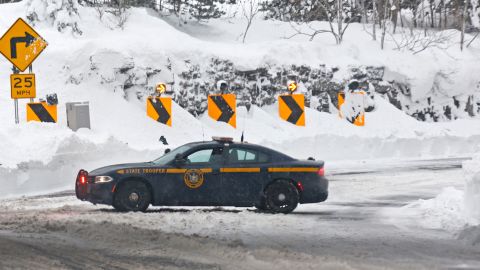 A New York State Police vehicle blocks the entrance to Route 198 after a winter storm in Buffalo on Tuesday.