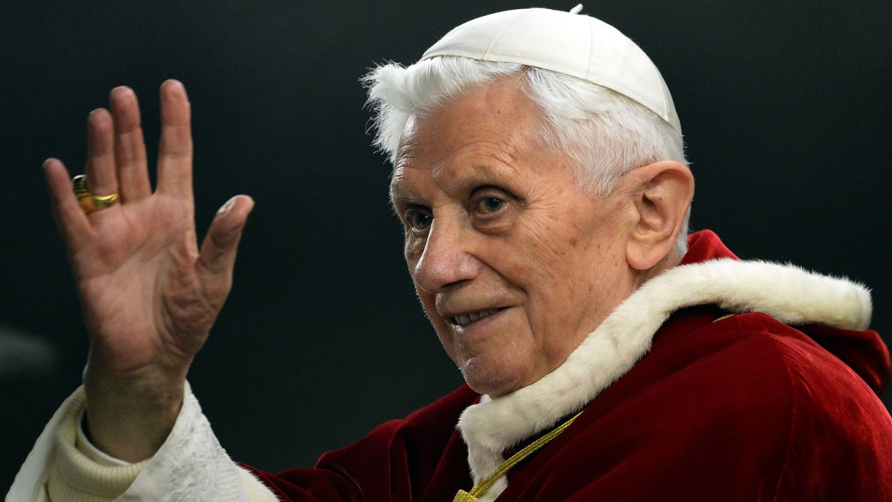 This file picture taken on December 29, 2012, in St.Peter's square at the Vatican shows Pope Benedict XVI saluting as he arrives to the ecumenical christian community of Taize during their European meeting. Pope Benedict XVI on February 11, 2013 announced he will resign on February 28, a Vatican spokesman told AFP, which will make him the first pope to do so in centuries. AFP PHOTO / FILES / ALBERTO PIZZOLI        (Photo credit should read ALBERTO PIZZOLI/AFP via Getty Images)
