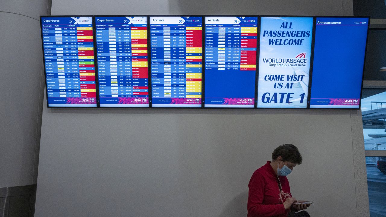 Canceled Southwest Airlines flights are displayed on an information board at Oakland International Airport (OAK) on Tuesday.