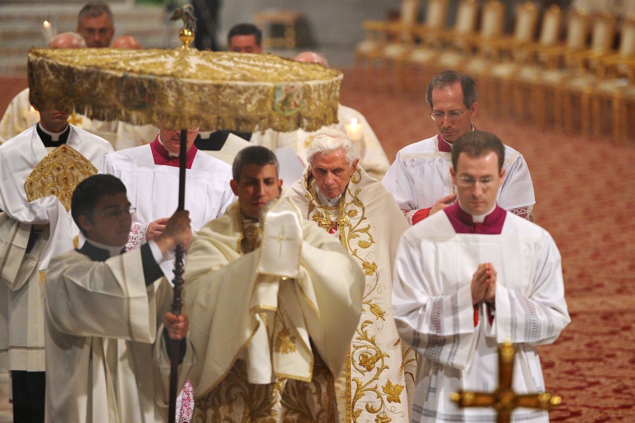 Benedict walks at the end of a Holy Thursday Mass in April 2012.