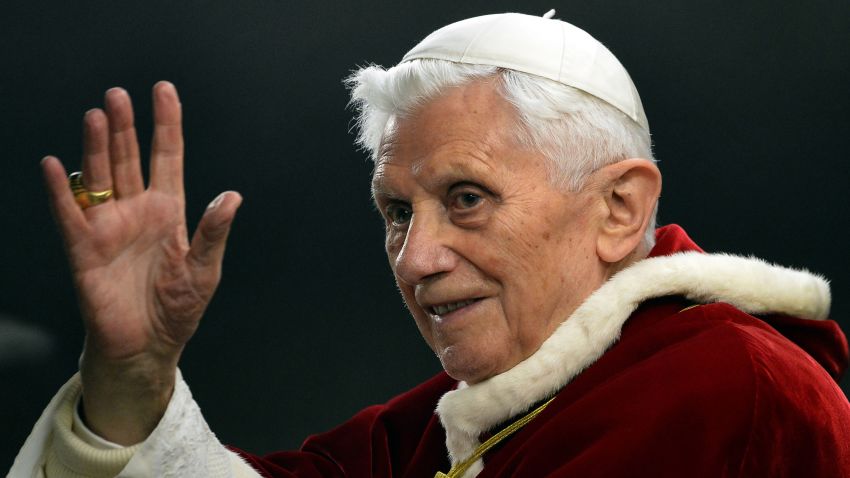 (FILES) This file photo taken on December 29, 2012 in St. Peter's Square in the Vatican shows Pope Benedict XVI greeting as he arrives at the Ecumenical Christian Community of Theseus during their European meeting.  Pope Benedict XVI announced on February 11, 2013 that he would resign on February 28, a Vatican spokesman told AFP, making him the first pope to do so in centuries.  AFP PHOTO / FILES / ALBERTO PIZZOLI (Photo should read ALBERTO PIZZOLI/AFP via Getty Images)