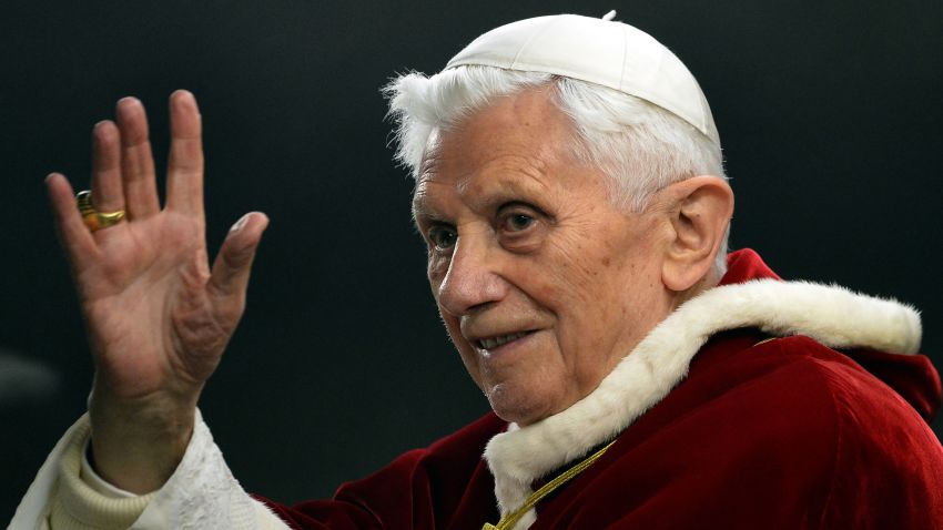 (Files) This photo taken on December 29, 2012, in St. Peter's Square, Vatican, shows Pope Benedict XVI saluting upon his arrival at the Ecumenical Christian Community in Taise during their European meeting.  Pope Benedict XVI announced on February 11, 2013 that he would resign on February 28, a Vatican spokesman told AFP, making him the first pope to do so in centuries.  AFP PHOTO / FILES / ALBERTO PIZZOLI (Photo credit should read ALBERTO PIZZOLI / AFP via Getty Images)