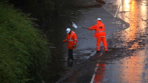 Crews are working Tuesday to clear a flooded section of Highway 13 northbound in Oakland, California.
