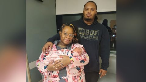 Erica, Davon and newborn Devynn Thomas safely at the hospital after giving birth in their Buffalo home.