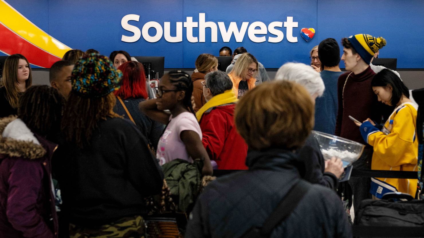 Travelers wait in line at the Southwest Airlines ticketing counter at Nashville International Airport (Seth Herald / AFP)