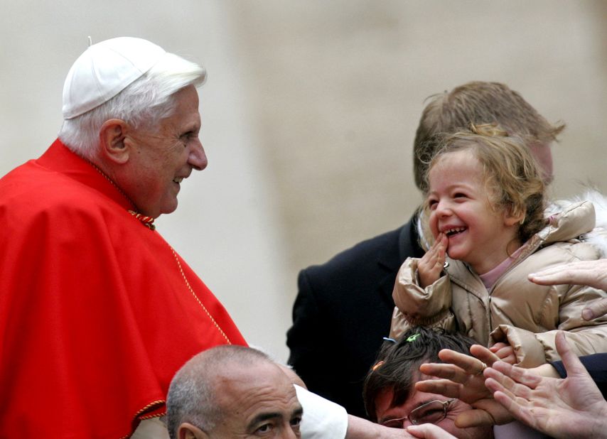 Benedict looks at a child during his weekly general audience in St. Peter's Square in November 2005.