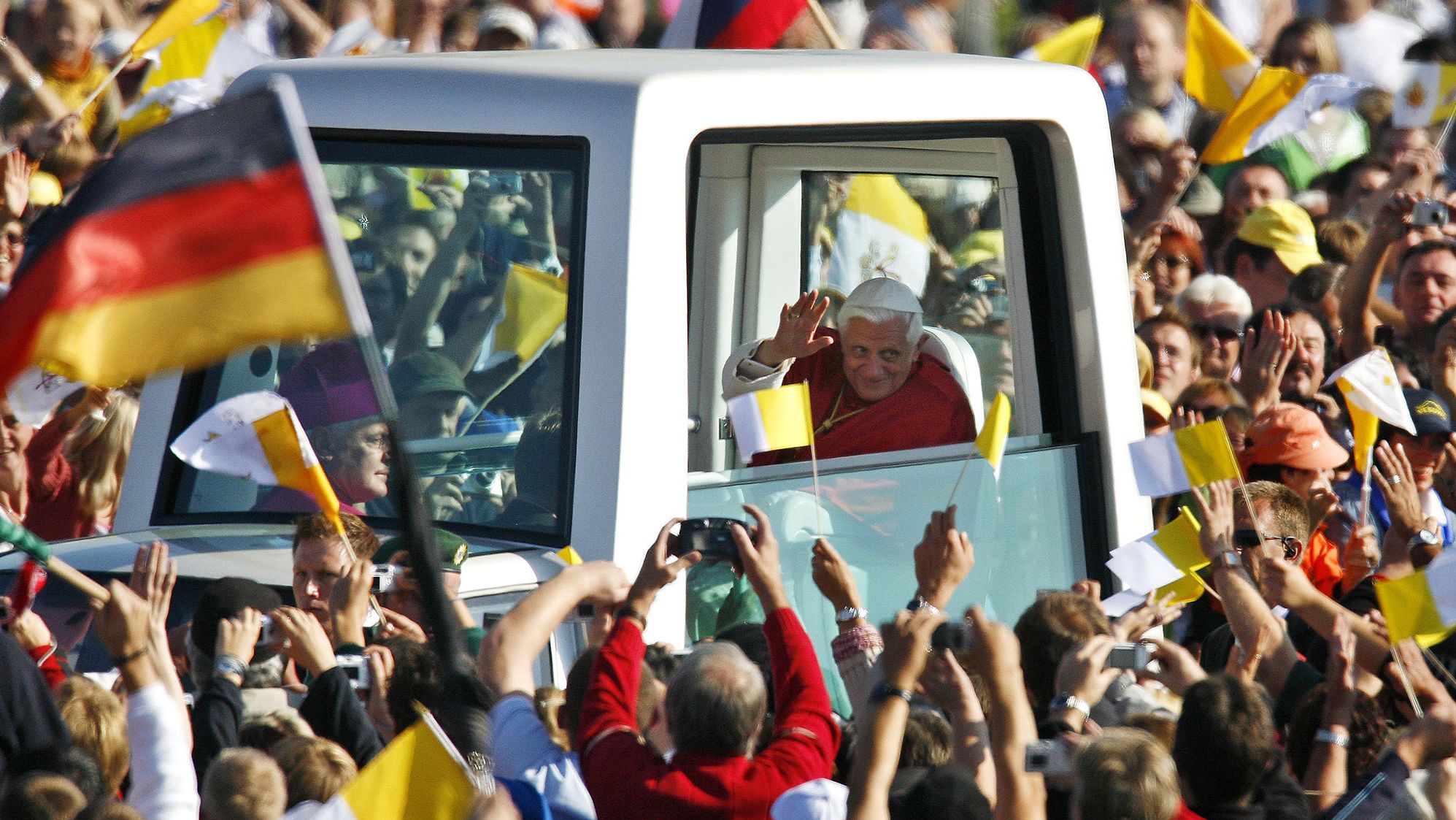 The Pope waves to people from his "popemobile" as he arrives for a Mass in Regensburg, Germany, in September 2006. He was on a six-day visit to his native country.